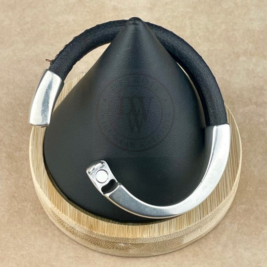 This unisex bracelet features a black leather band accented with an antique copper chain for a warm, rustic touch. The long, arcing, antique silver magnetic clasp ensures a secure and effortless closure. The mix of dark leather, vintage copper, and aged silver creates a distinctive, timeless look that adds subtle character to any style.