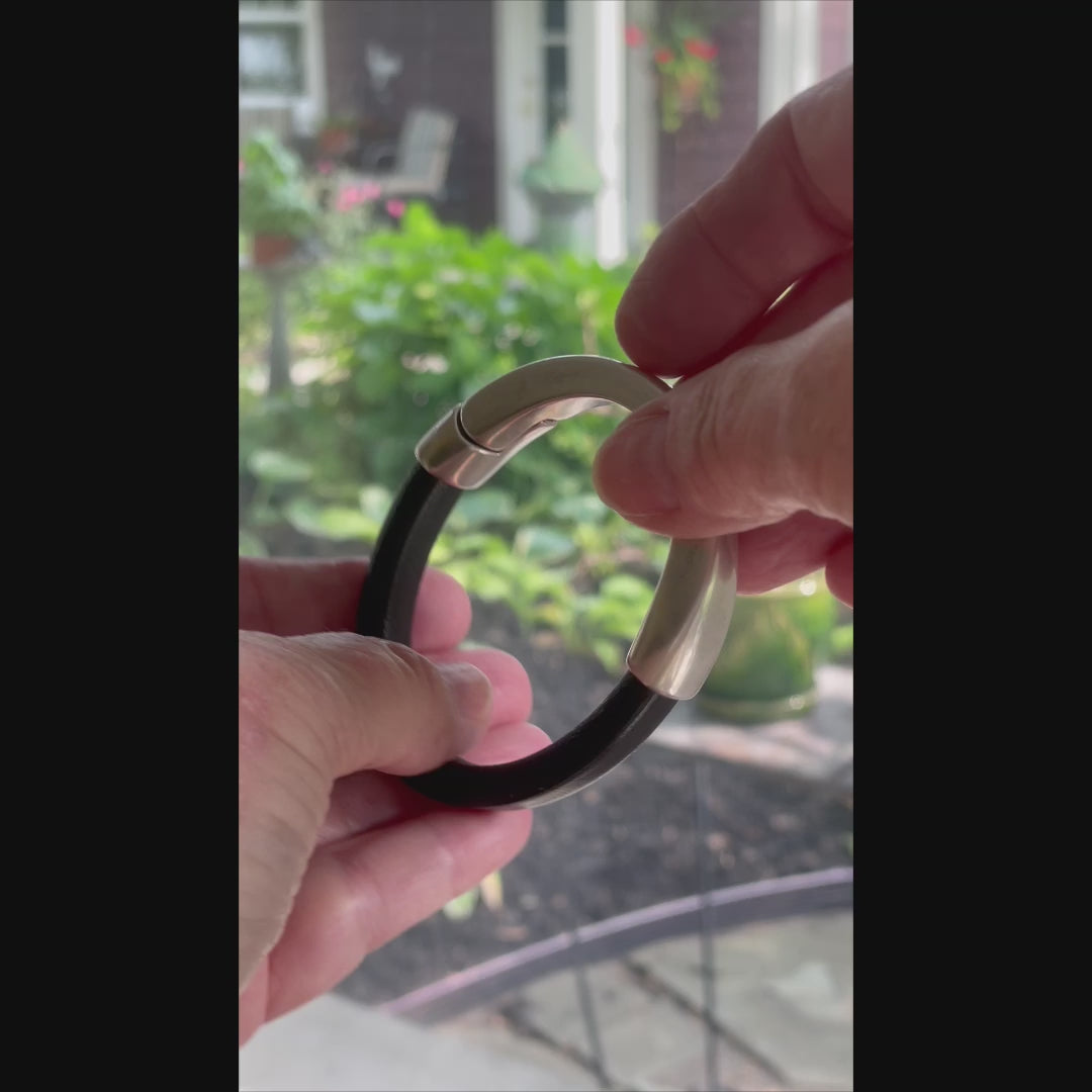 This video demonstrates how to open and securely close the Arena bracelet’s magnetic clasp. It shows how the antique silver clasp smoothly separates with a gentle pull and effortlessly snaps back into place, ensuring a secure fit. The magnetic mechanism provides both ease of use and a firm hold, making it simple to fasten and remove the bracelet with one hand.